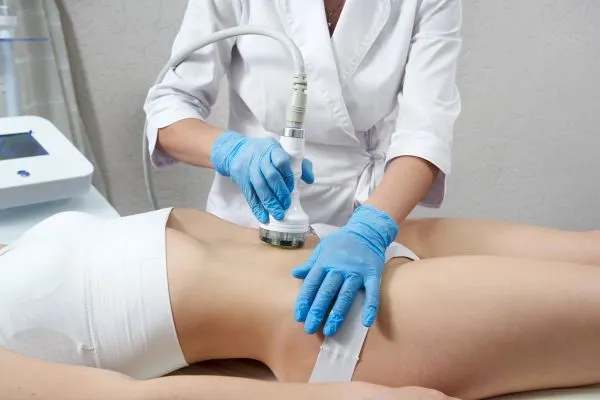 Lost the Weight but Not the Loose Skin? 2 woman having HIFU treatment on her stomach to combat loose skin Ashby Magna following weight loss